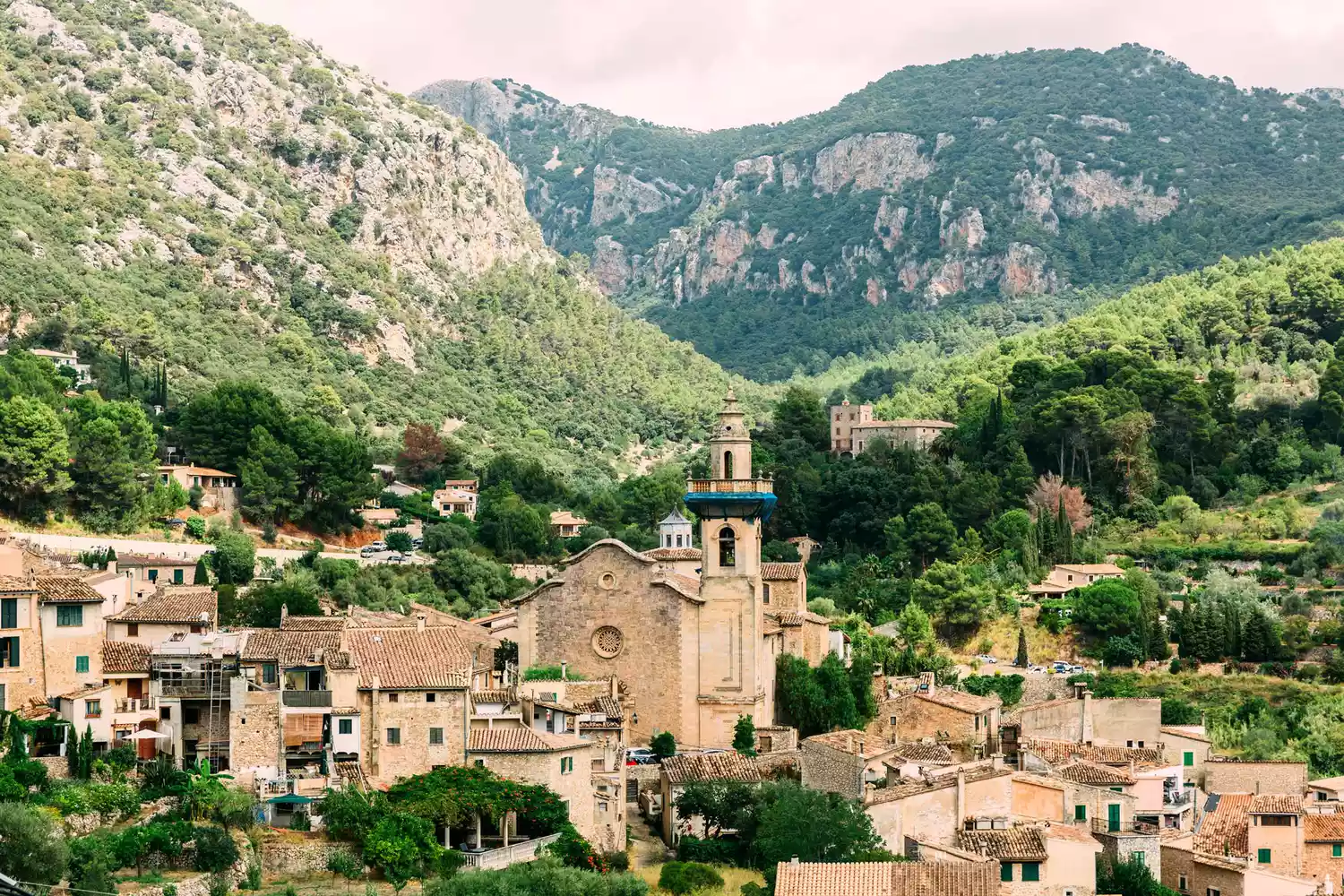 Valldemossa village surrounded by green mountains on Mallorca island